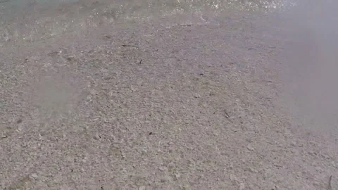 Soft Beach Sand as the Crystal Clear Ocean Tide Rolls In Stock Footage 185094884