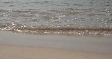 Soft beautiful sea waves on sandy beach Video stock 148833213