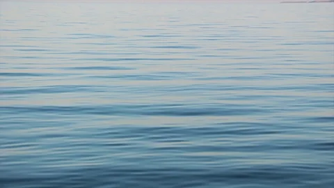 Soft beautiful water waves reflecting the rays of the sun Stock Footage 114958963