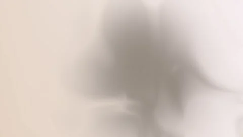 Soft beige and gray gradient with smooth, flowing edges. Seamless loop Stock Footage 309856089