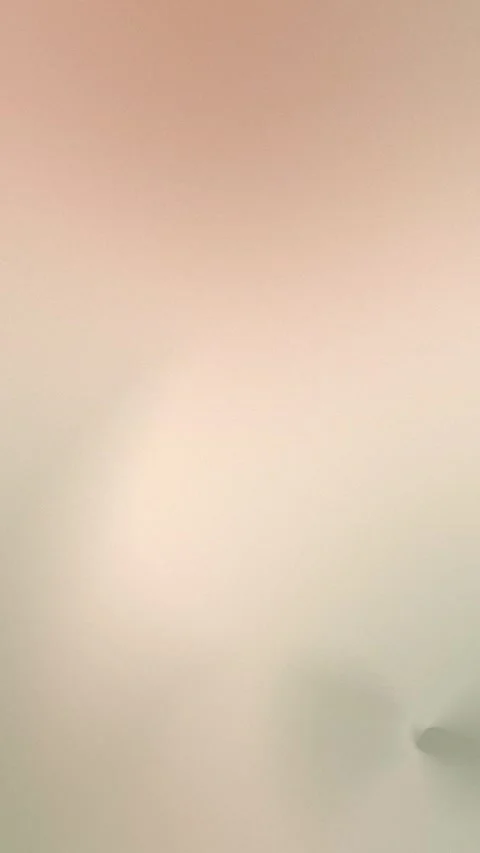 Soft beige and pink gradient with subtle circular shapes. Seamless loop Stock Footage 309956901