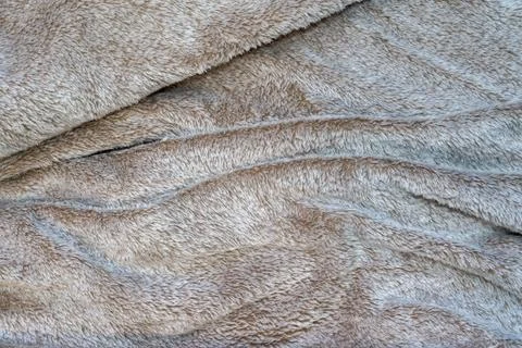 Soft beige fabric texture with wavy patterns, suitable for various applications, Stock Photos