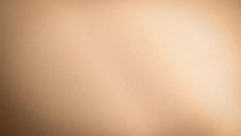 Soft beige grainy textured background with light brown and cream gradient i.. Stock Photos