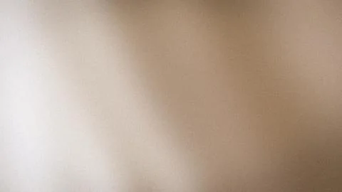 Soft beige light gradient abstract grainy background blur in 4K resolution .. Stock Photos