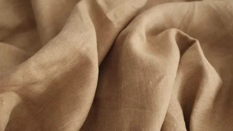 Soft beige linen fabric. Expensive fabric for luxury clothes. Stock Footage 317094114