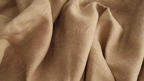 Soft beige linen fabric. Expensive fabric for luxury clothes. Video stock 317094142
