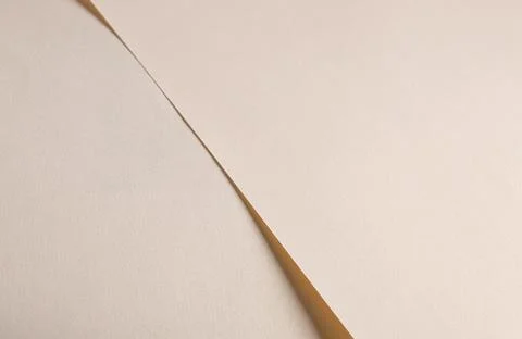 Soft beige paper texture with light gold and champagne tones, glossy finish.. Stock Photos