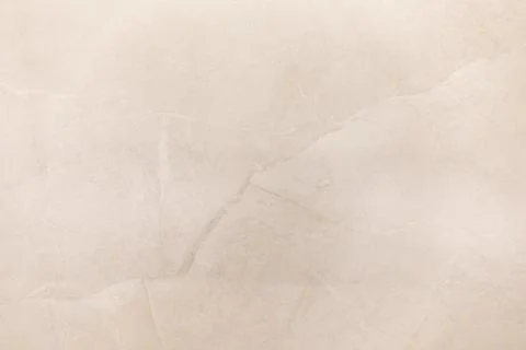 Soft beige textured background with subtle creases and natural imperfections Foto stock