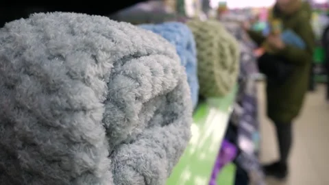 Soft blankets. Soft blankets on a store shelf Stock-Footage 269971295