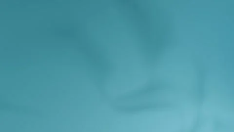 Soft blue abstract background with smooth shadows. Seamless loop background. 4K 動画素材 309856074