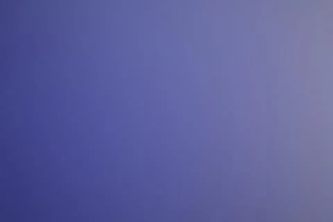 A soft blue and lavender gradient fills the frame with subtle tonal variati.. Illustrazione stock