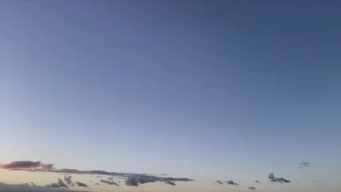 Soft Blue and Pink Clouds in Blue Evening Sky Near Horizon. Time Lapse Stock-Footage 347535700