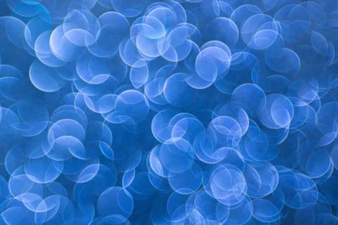 Soft blue bokeh on an abstract background for digital design, event screens.. Stock Photos
