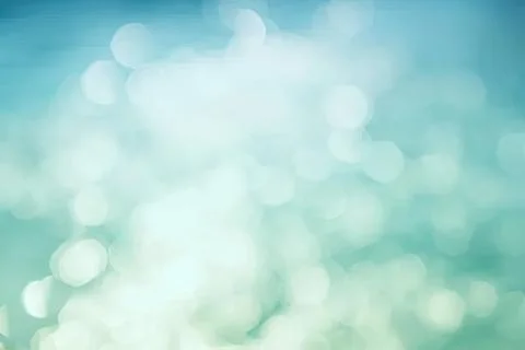 Soft blue bokeh background with light circles and glow Stock Photos