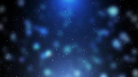 Soft blue bokeh particles float in a dark space, while snow and snowflakes cr Stock Footage 327454355