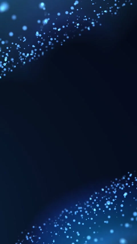 Soft blue bokeh particles sweep across a dark vertical frame with copy spac.. Stock Footage 337155559