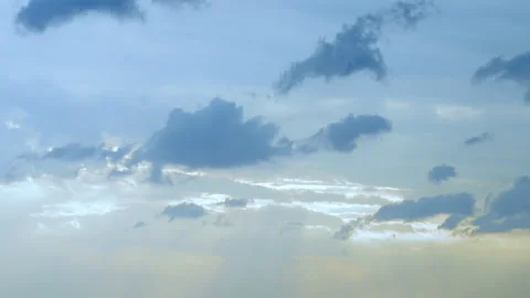 Soft blue clouds drifting in seamless looping background Stock Footage 345616198