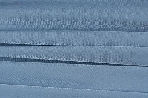 Soft Blue Fabric Background with Abstract Patterns and Empty Text Space 스톡 사진