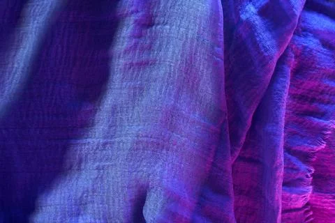 Soft blue fabric draped on a flat surface showing texture and details in na.. Stock Photos