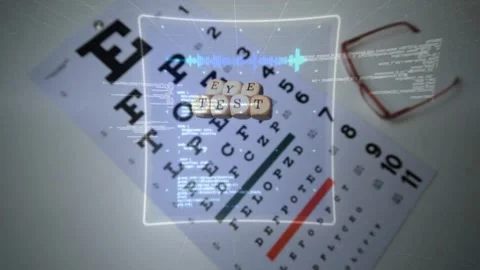 Soft blue glow appearing and HUD elements scanning Snellen eye chart for Stock Footage 332468987