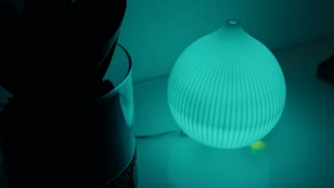 Soft blue glow from modern ribbed diffuser Video stock 313099138