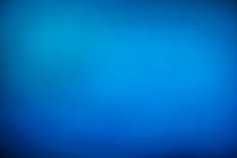 Soft blue gradient background with smooth transitions and gentle light. Stock Photos