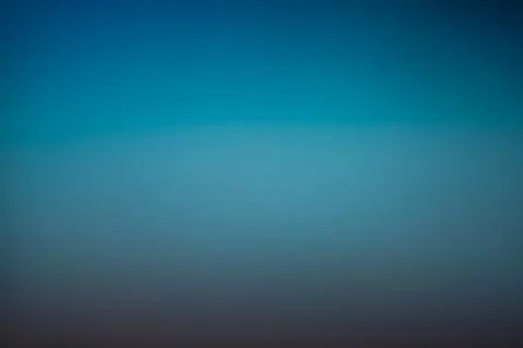 Soft blue gradient background with smooth transitions and gentle light. Stock Photos