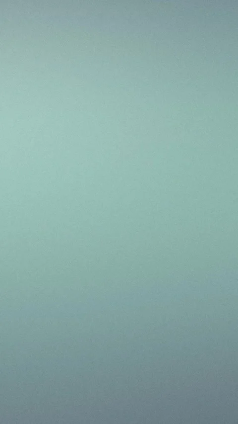 Soft blue gradient with subtle grain texture. Seamless loop background. 4K. Stock Footage 309855985