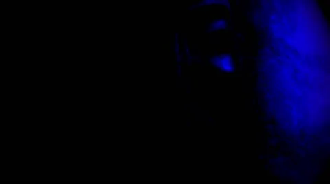 Soft Blue Light Moves Along Mongolian Mask in the Dark Closeup Stock Footage 62636097