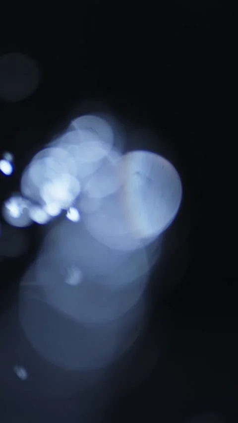 Soft Blue Light Reflections Creating Abstract Patterns in Motion Stock Footage 336590666