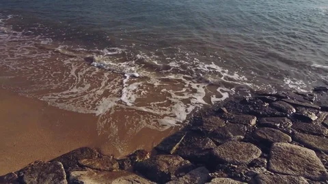 Soft blue ocean wave on sandy beach  Stock Footage 128528131