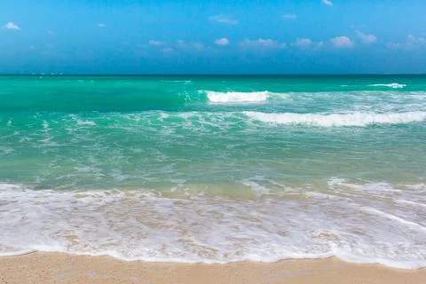 Soft Blue Ocean Wave On Sandy Beach. Background. Stock Photos