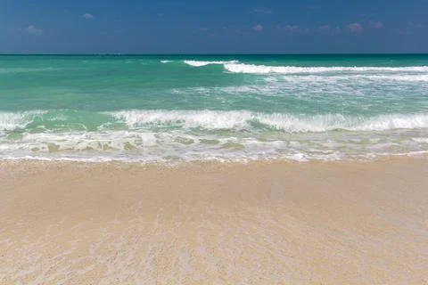Soft Blue Ocean Wave On Sandy Beach. Background. Stock Photos