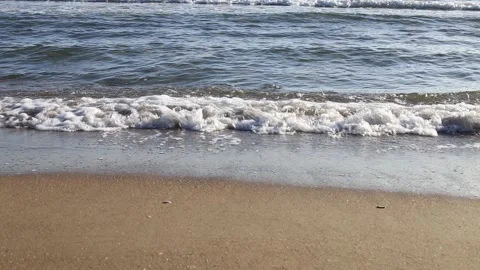 Soft blue sea waves breaking on a shore at a sandy tropical beach Stock-Footage 154787731