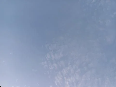 Soft Blue Sky with Mottled Clouds Stock Photos