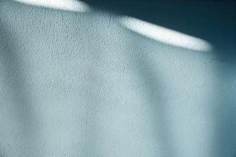 Soft blue textured wall background with gentle natural shadows creating abs.. Stock Photos