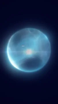 Soft blue translucent orb with lens flare and halo on dark background, crea.. Stock Illustration