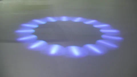 Soft blue-violet light forms a circular ring of glowing segments on the ground Vidéo 337280224