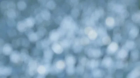 Soft blue water bokeh background, calm slow moving light reflections and ab.. Video stock 342624192