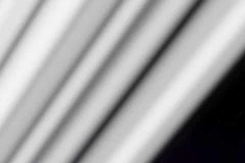 Soft, blurred diagonal light stripes cut across a dark, starry void. Minima.. イラスト素材
