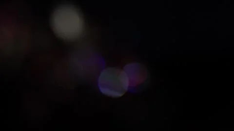 Soft, blurred light effect in the dark with colored light overlay Vídeo Stock 318575950