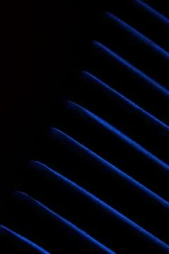 Soft blurred metal texture diagonal line pattern background with blue light Stock Photos