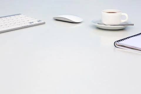 Soft Blurred Office Background with Computer Keyboard Mouse Coffee Mug and Stock Photos