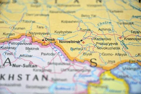 Soft Blurred World Map Highlight of Novosibirsk with Defocused Background Stock Photos