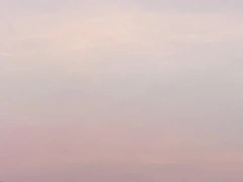 Soft Blush-Pastel Cloud Background with Diffused Haze and Minimal Open Space Stock Photos