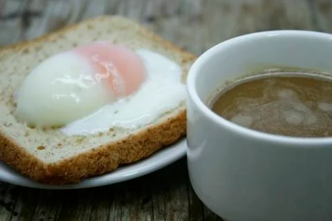Soft-boiled egg and a cup of coffee Stock Photos