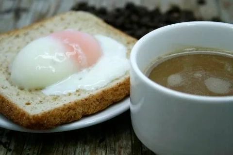 Soft-boiled egg and a cup of coffee Stock Photos
