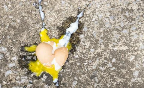 Soft boiled egg broken on the floor., copy space for text., food expired conc Stock Photos