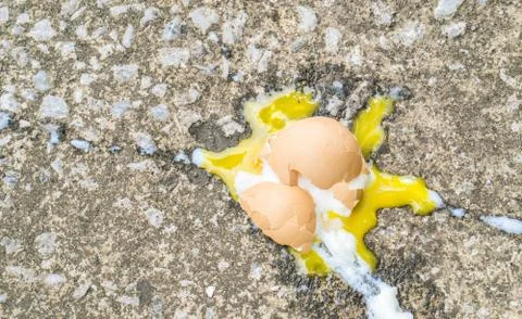 Soft boiled egg broken on the floor., copy space for text., food expired conc Stock Photos