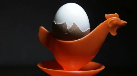 Soft-boiled egg in eggcup Stock Footage 68904945